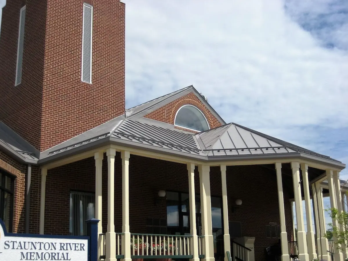 Skilled roofing craftsmen working on a residential roof in Bammel